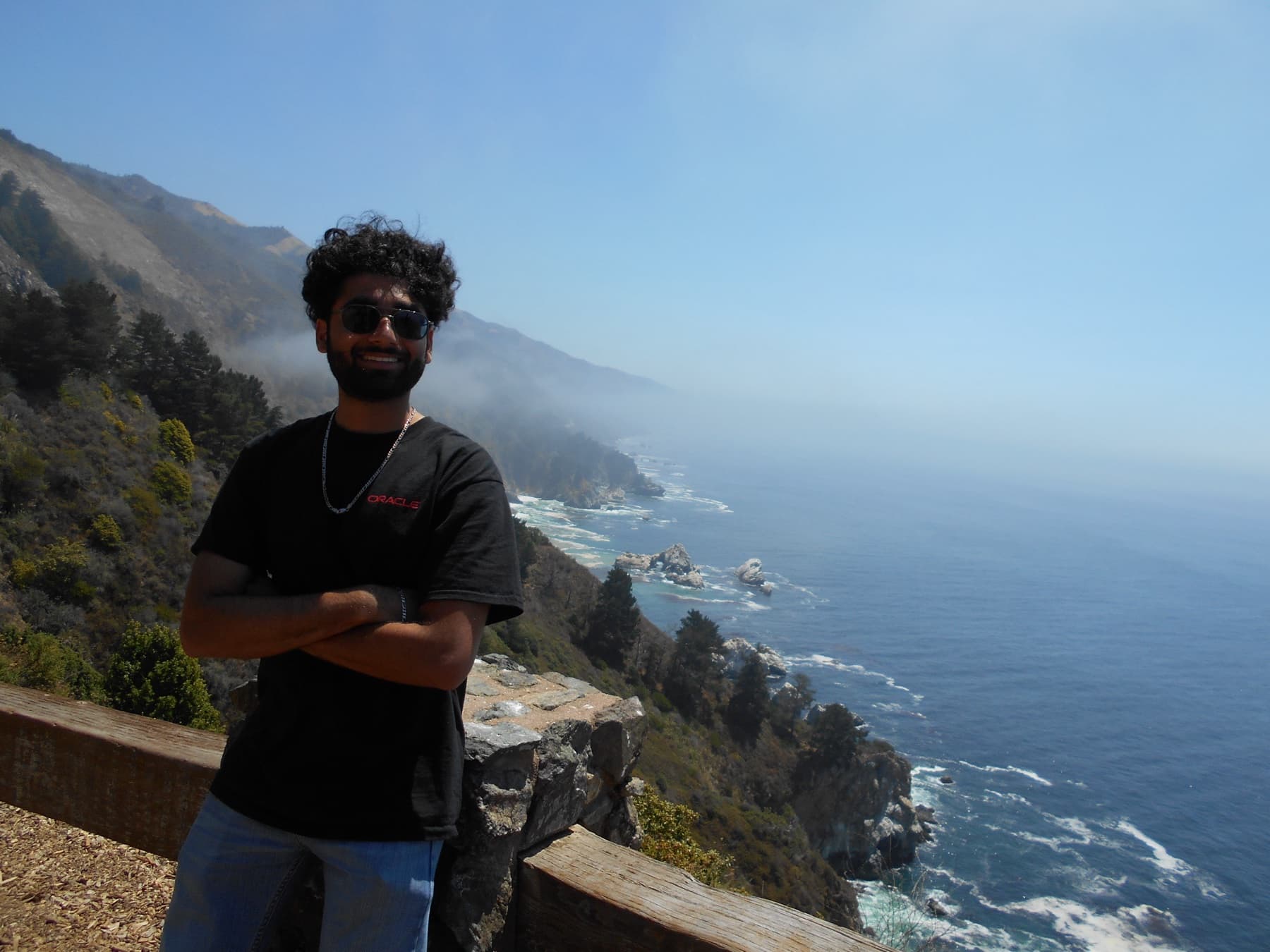 Gaurav Dama standing by a coastal overlook.